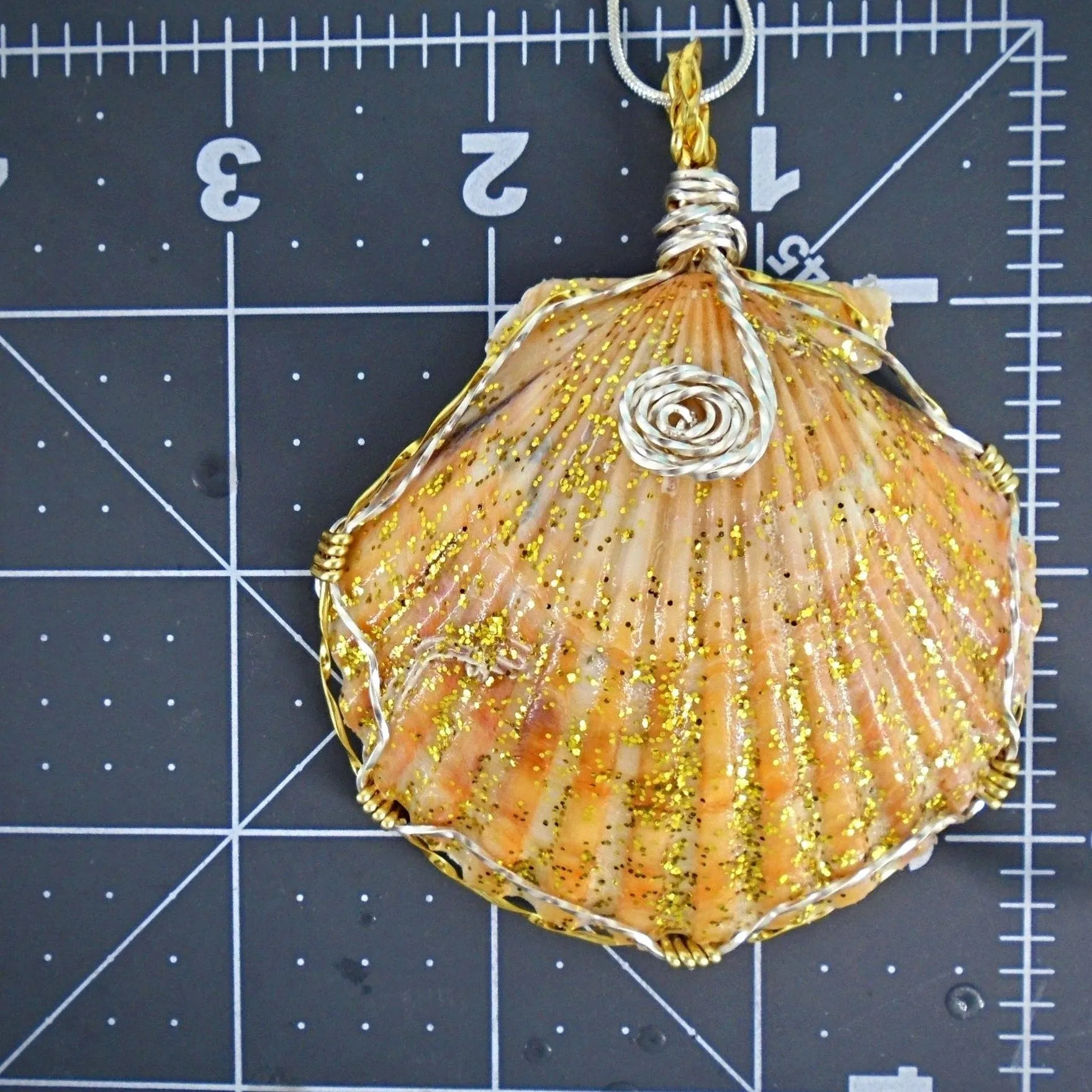 Handmade Pendant-Boho StyleLarge Orange/Gold Scallop Seashell Pendant with Glitter & Clear Glaze on Black Leather Rope