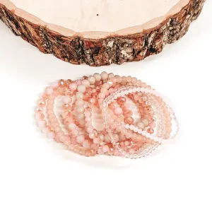 Nine Piece Crystal Beaded Bracelet Set in Baby Pink