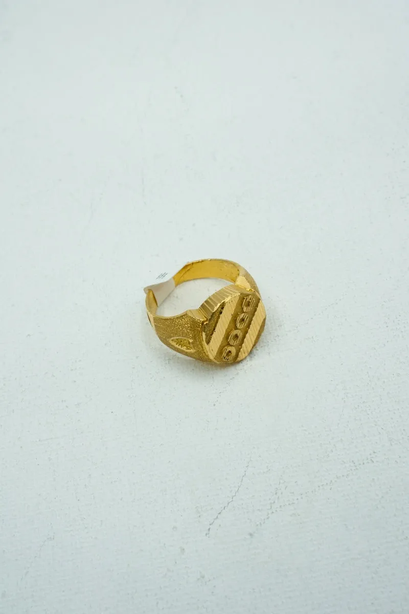 Understated yellow gold signet ring with engravings